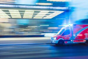 ambulance driving past hospital